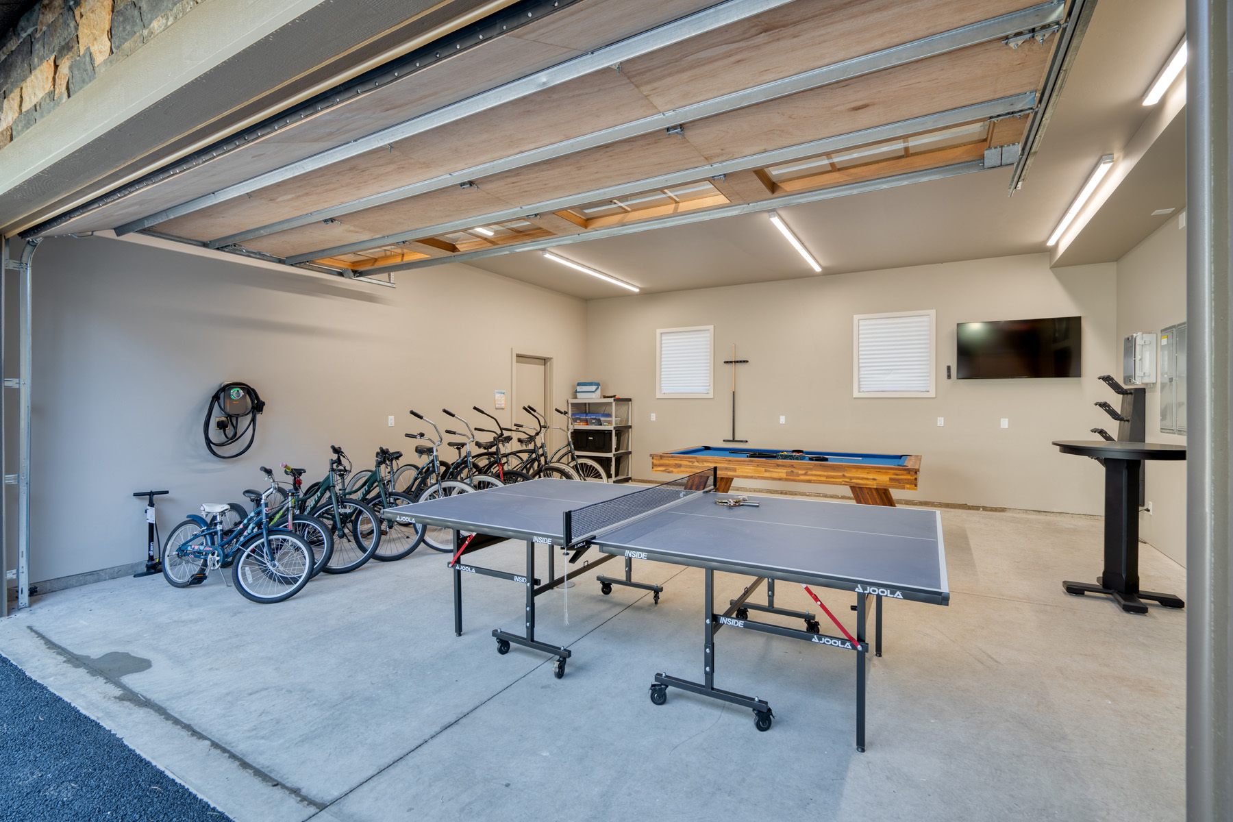 Garage with ping pong, pool table and bikes